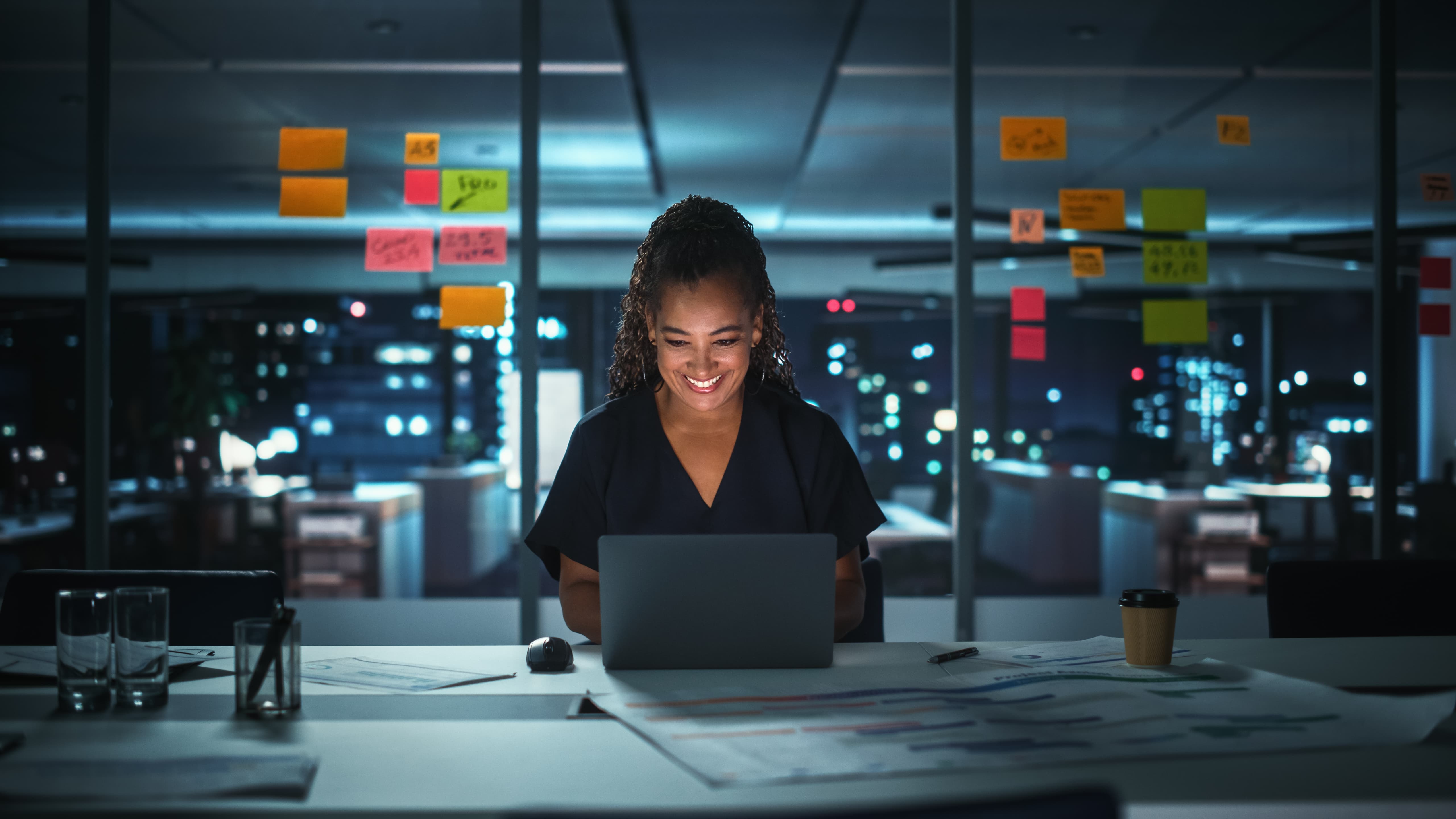 Businesswoman using laptop in office